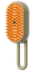 SteamGroom Pro Brush – orange silicone tips with built-in steam mist